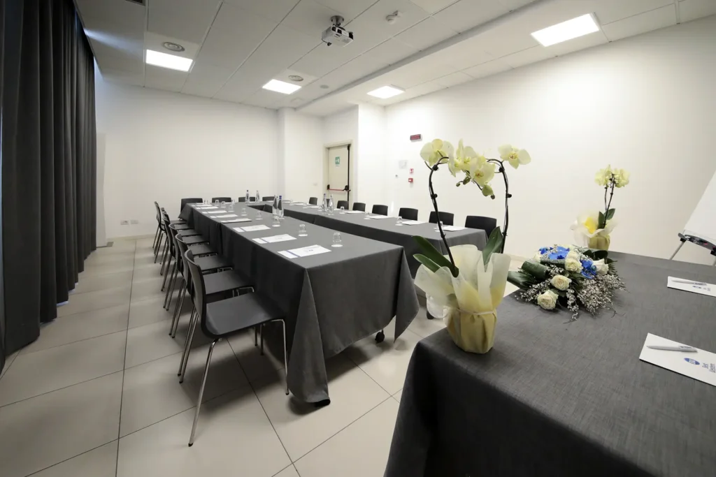 Pictured is a meeting room with a horseshoe arrangement